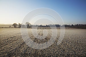 Empty football pitch and frosty winter morning