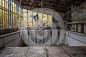 Empty forgotten swimming pool in the abandoned school building located in the Chernobyl ghost town