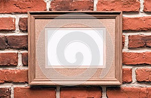 Empty frame on brick wall