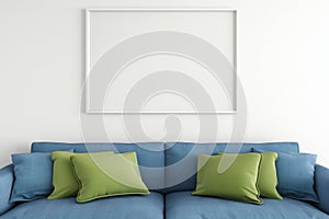 empty frame on a white wall above a blue sofa with green cushions