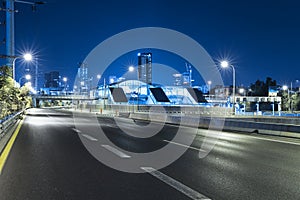 Empty freeway at night And Tel Aviv Cityscape