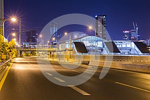 Empty freeway at night And Tel Aviv Cityscape