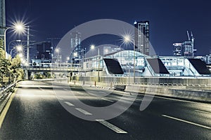 Empty freeway at night And Tel Aviv Cityscape