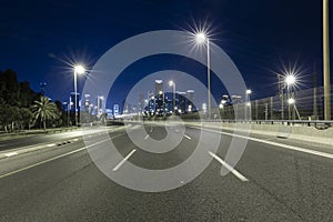 Empty Freeway At Night And Tel Aviv Skyline in Background