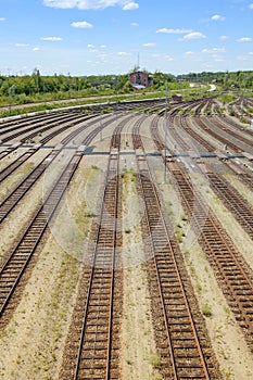 Empty freight railway yard with many tracks and operations control tower