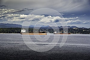 Empty freighters and container ships anchored off the coast of Vancouver Island awaiting to be loaded