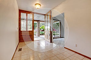 Empty front entrance with open door. Home interior.