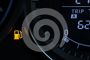 Empty fuel warning light in car dashboard. Fuel pump icon. gasoline gauge dash board in car with digital warning sign of run out o