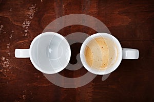 Empty and full cup of fresh coffee on rustic wooden table, benefits and harms of coffee concept photo