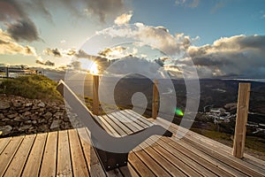 Empty garden bench during sunset, at the CabeÃ§o da Urra viewpoint in the town of Pampilhosa da Serra photo