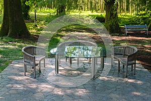 Empty garden furniture with glass table for leisure time