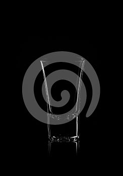 Empty glass on a black