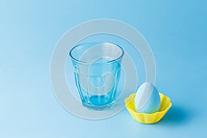 Empty glass on a blue background