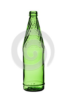 Empty glass bottle of green color on a white background