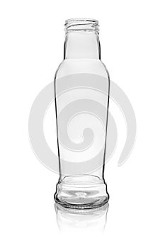Empty glass bottle with a wide neck for drinks. Isolated on a white background with reflection
