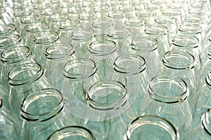 Empty glass bottles in a bottling plant or store