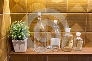 Empty glass bottles on wall background