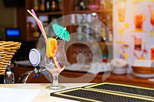 Empty glass from cocktail with umbrella