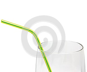 Empty Glass And Drinking straw macro closeup isolated, yellow and green, large detailed studio shot