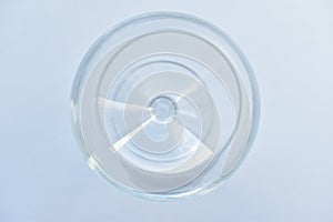 Empty glass goblet on a white background