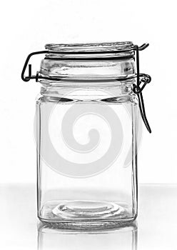 Empty glass jar for jam on the lumen