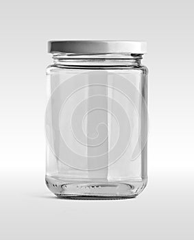 Empty glass jar and white cap in front view isolated on white background.