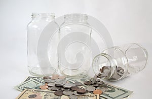 Empty glass jars and money
