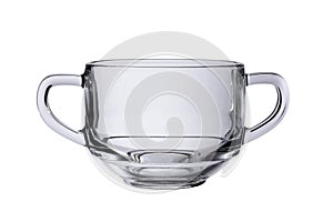 Empty glass mug with two handles for soups or broths isolated on a white background