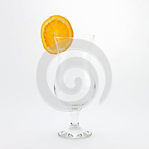 Empty glass with orange slice