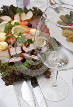 Empty glass and plate fish viands photo