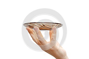 Empty glass saucer in a female hand