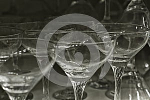 Empty glass set. on dark background.Transparent goblets textured