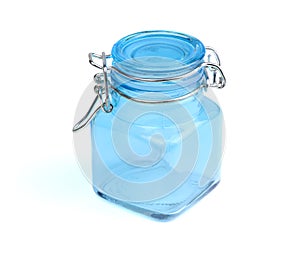 Empty glass spice jar.Blue jar for spice isolated on a white background. Cooking utensil. Kitchen ware. Kitchen utensils