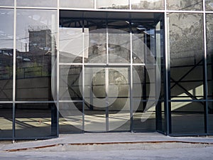 Empty glassed room for business. Premises for a car showroom. Abandoned place. Business decline concept