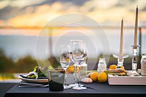 Empty glasses set in restaurant - Dinner table outdoors at sunset