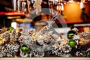 Empty Glasses Of Wine Above A Bar Rack On The Christmas Decorations Backgroun