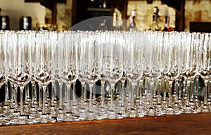 Empty glasses for wine or champagne are on the bar in the restaurant