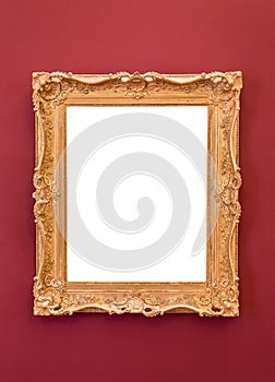 Empty golden picture frame on the wall