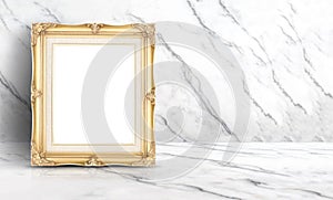 Empty golden vintage frame at white clean marble wall and floor