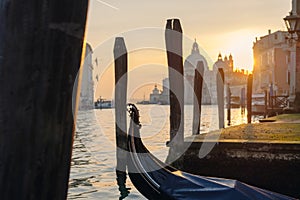 Empty gondola at the pier at sunset