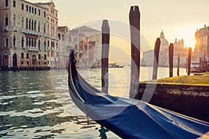 Empty gondola at the pier at sunset