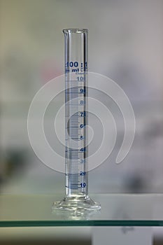 Empty graduated cylinder into chemistry laboratory