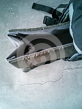 Empty gray black photo bag.  on concrete background.