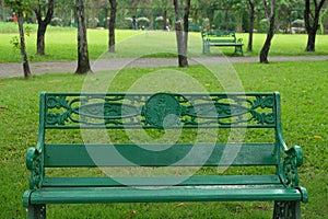 Empty green chair in the public park