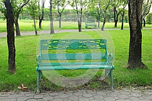 Empty green chair in the public park
