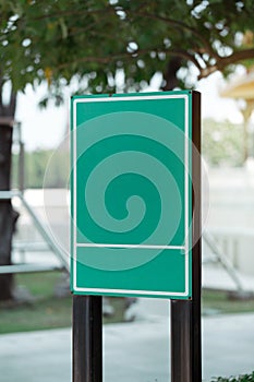 Empty green metal sign in public area