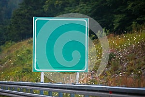 Empty green road sign