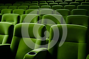 empty green seats in cinema, domestic intimacy, zoom in, up close