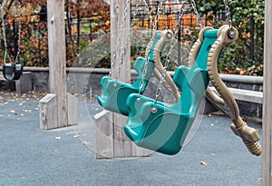 Empty green swings