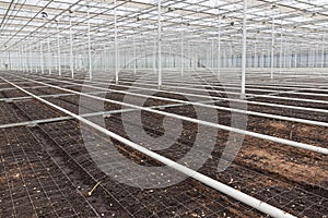 Empty greenhouse with soil prepared for cultivation of plants